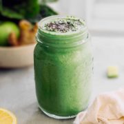 glass with fresh Arugula Smoothie on a table