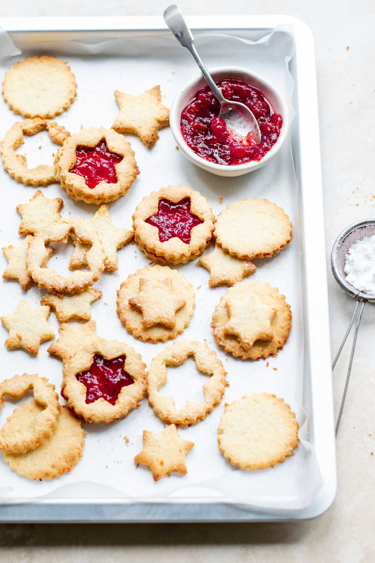 Star shaped Linzer cookies filled with cranberry sauce