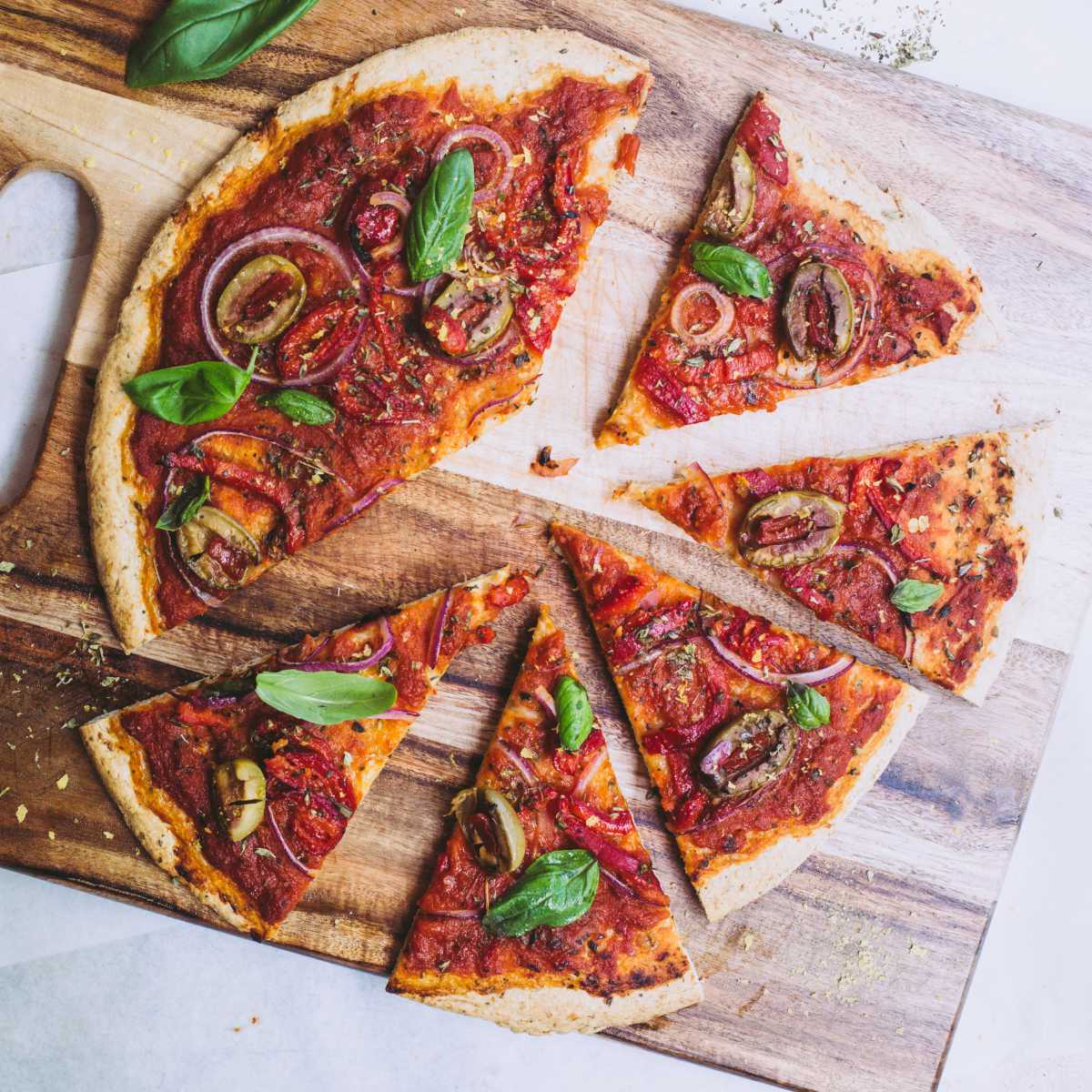 easy vegan flatbread pizza on a cutting board